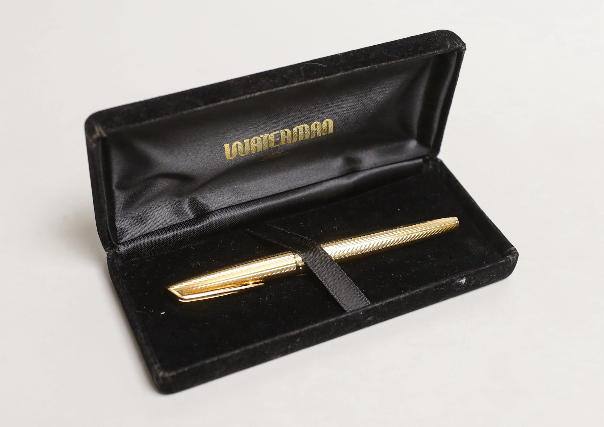 A cased gold plated Waterman fountain pen